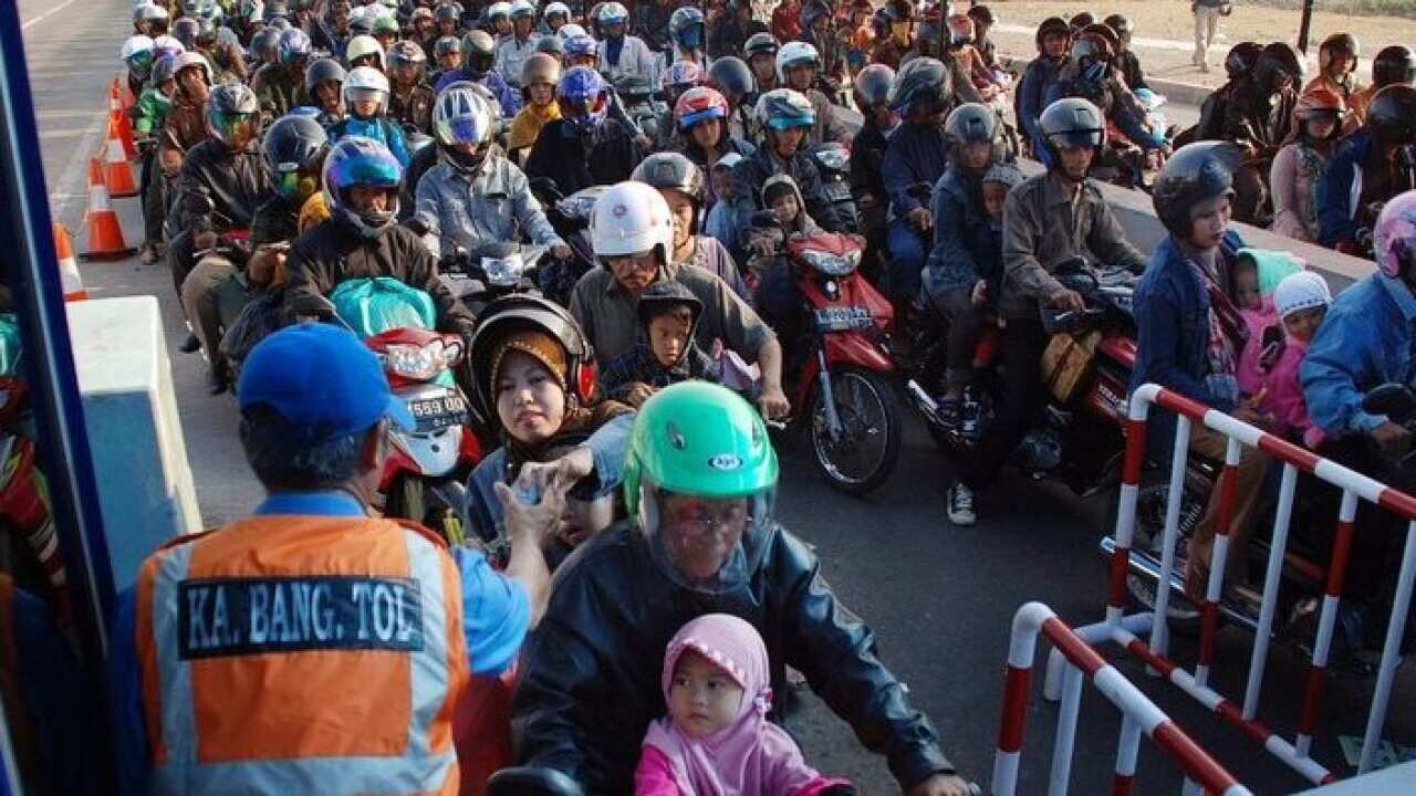 Thousands of motorists queue at a toll gate in Surabaya, Indonesia, as they travel to their home towns to celebrate the Eid al-Fitr holidays – China Morning Post, 24 June 2017.