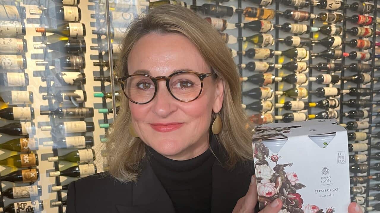 Denomination CEO and co-founder Rowena Curlewis holding a box of canned wine (SBS-Sandra Fulloon).jpg