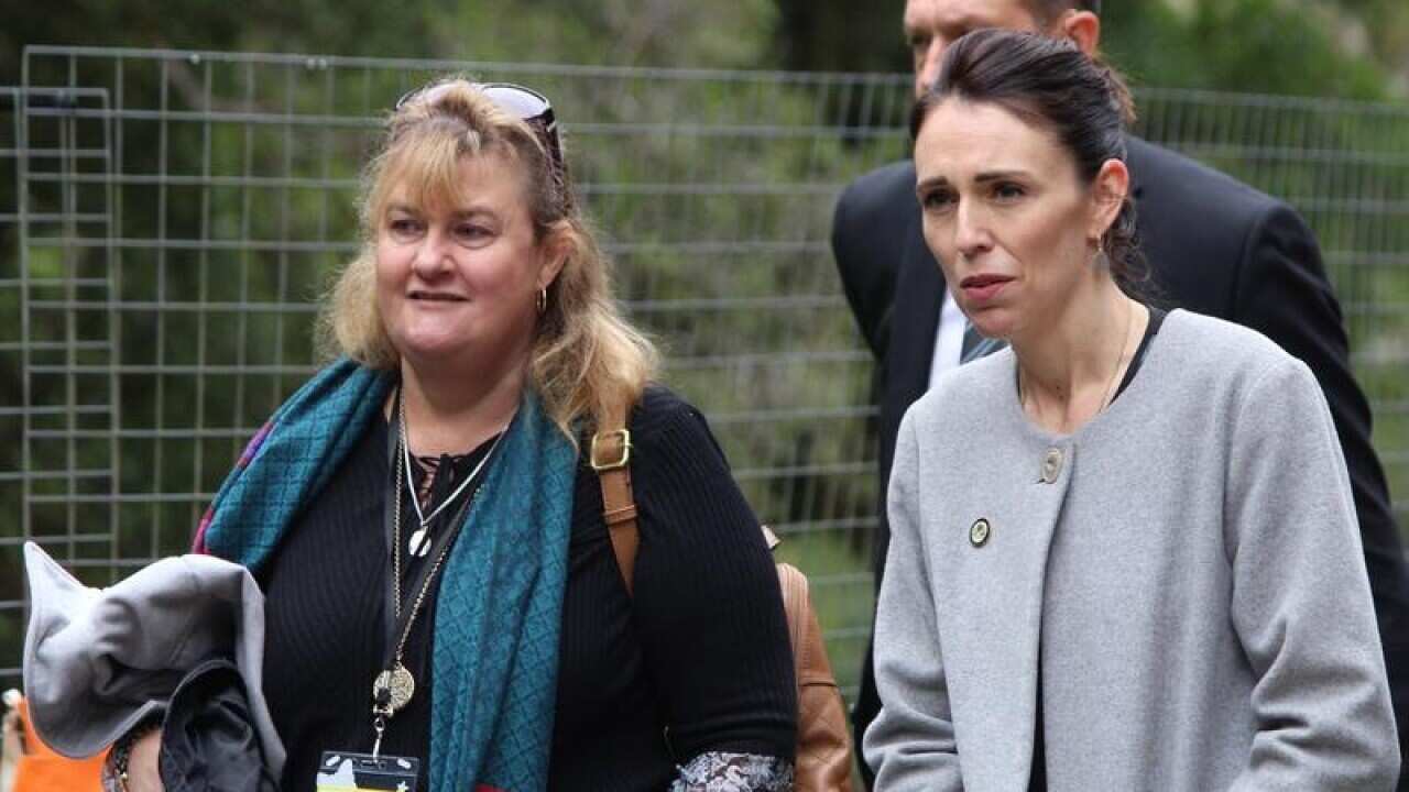 Joanne Ufer and Jacinda Adern chat as they walk to the mine entrance.