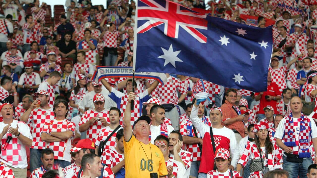 An Australian fan waves a flag amid Croatian supporters at the 2006 World Cup match between the two countries in Stuttgart - Getty Images-1.jpg