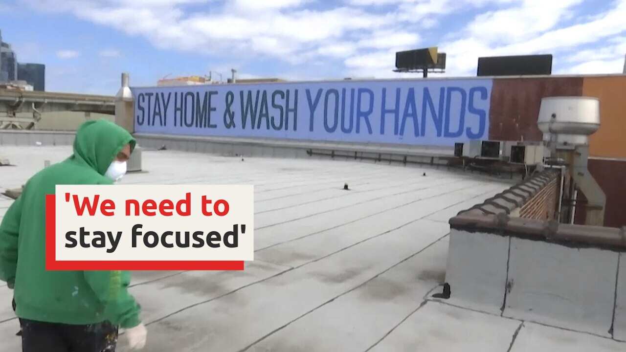 Street artist takes to NYC walls to fight virus