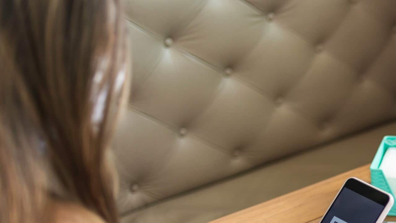 Customer scanning QR code to view food menu online