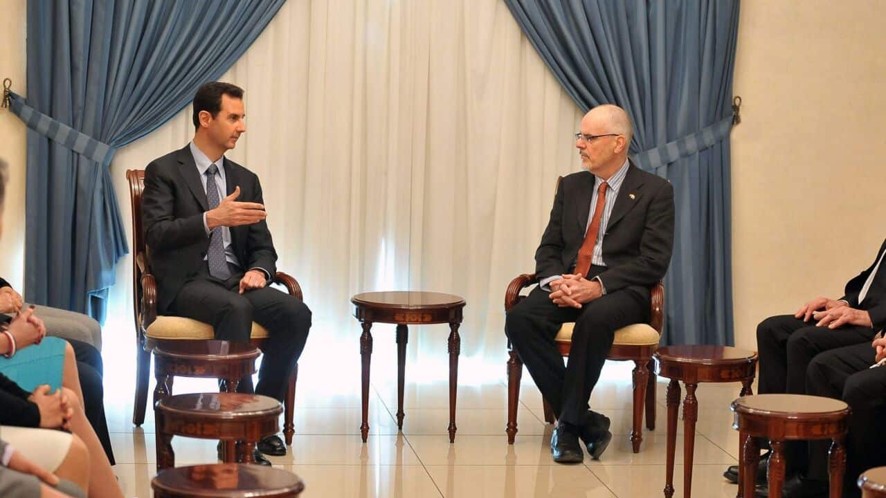 Syrian President Bashar al-Assad speaking to Tim Anderson - AAP-1.jpg