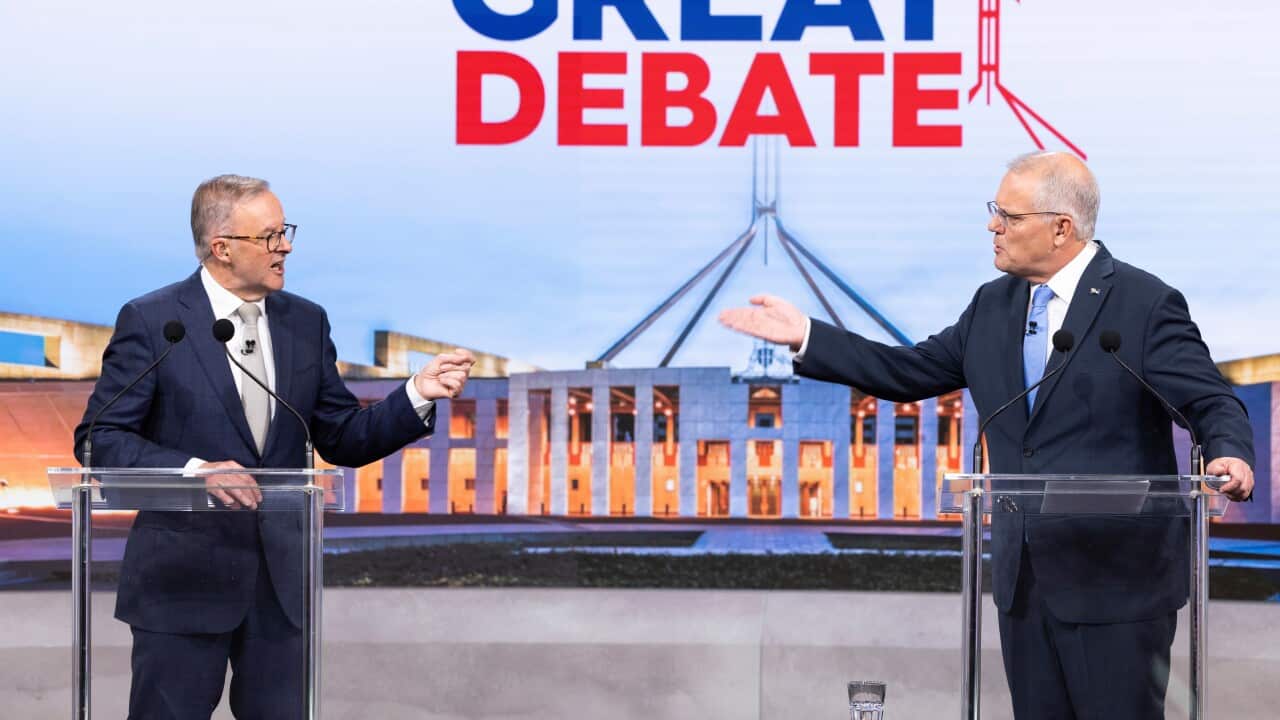 Australian Prime Minister Scott Morrison (right) and Opposition Leader Anthony Albanese during the second leaders' debate ahead of the federal election at Nine Studios in Sydney, Sunday, May 8, 2022. (AAP Image/Pool, Alex Ellinghausen) NO ARCHIVING