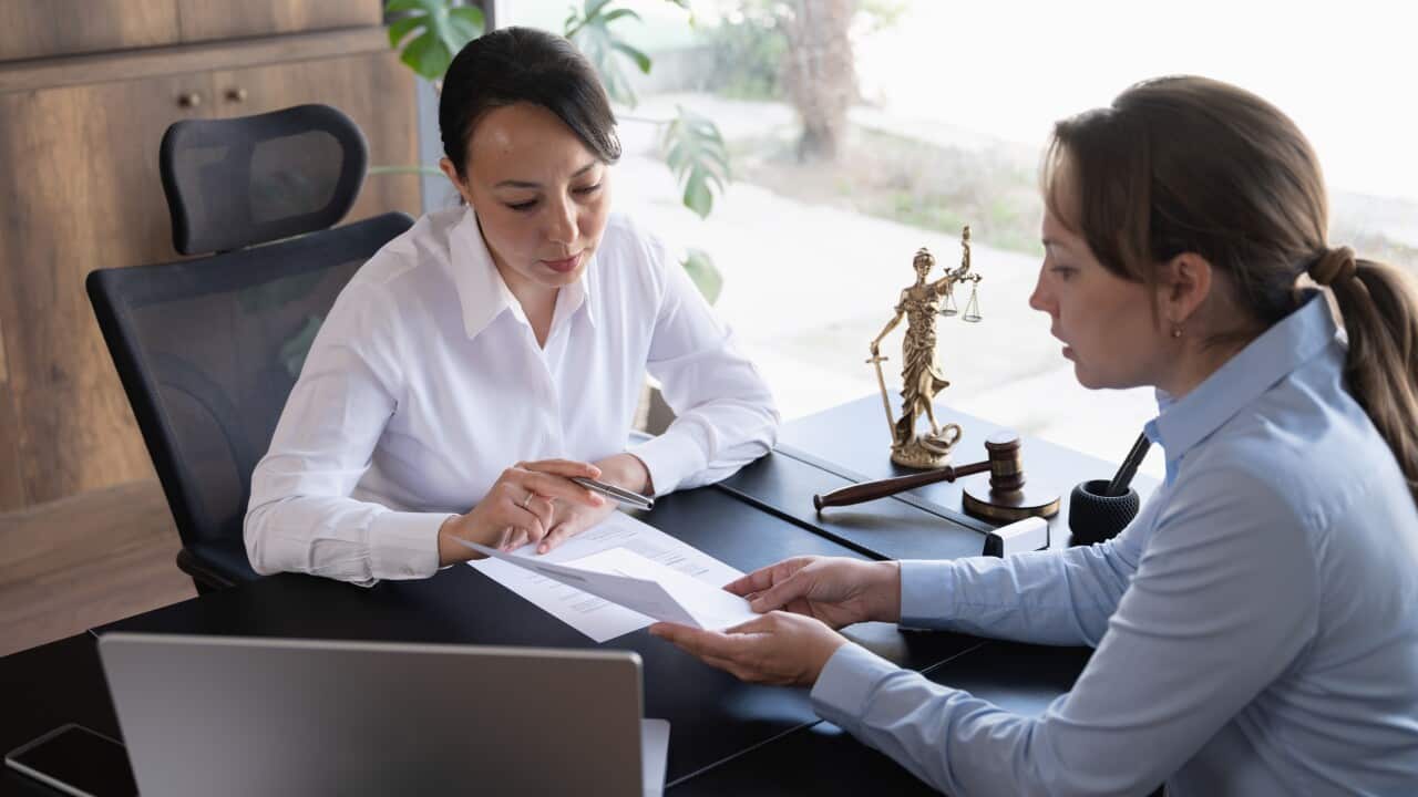 Female legal advisor lawyer helping her client