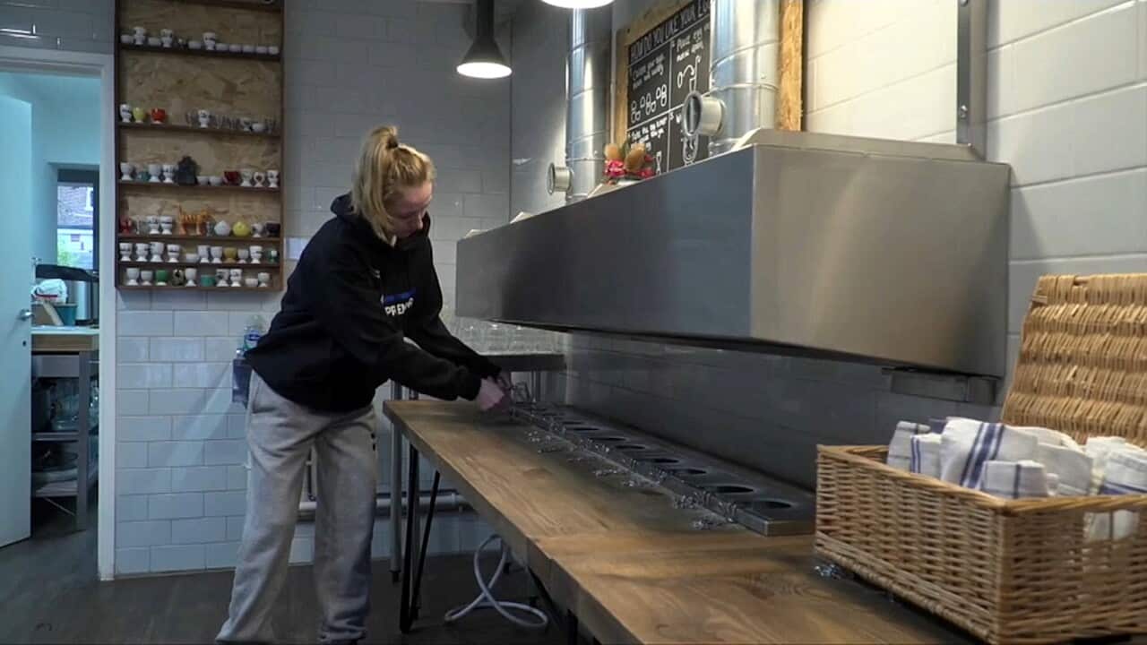 Charlie Blair working at the Eggs And Bread cafe in London