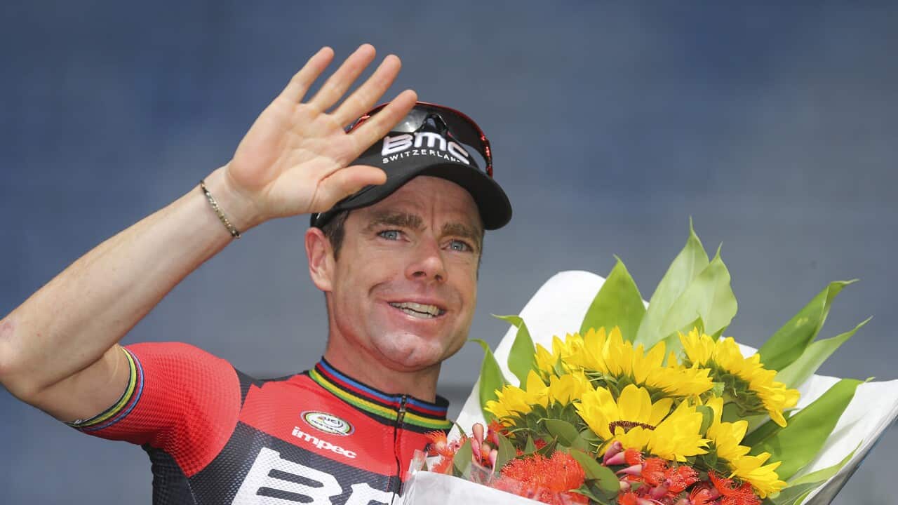 Cadel Evans waves to the crowd from the podium after the 2015 Cadel Evans Great Ocean Road Race on 1 February, 2015.