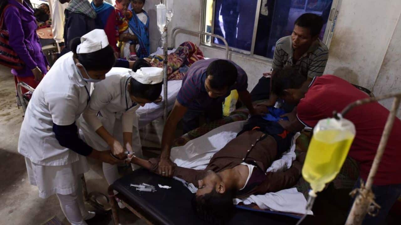 A patient who drank toxic bootleg liquor is treated at Kushal Konwar Civil Hospital in Golaghat district in northeastern India.