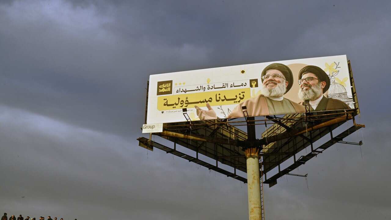 Hezbollah supporters protest at the entrance to Rafic Hariri International Airport