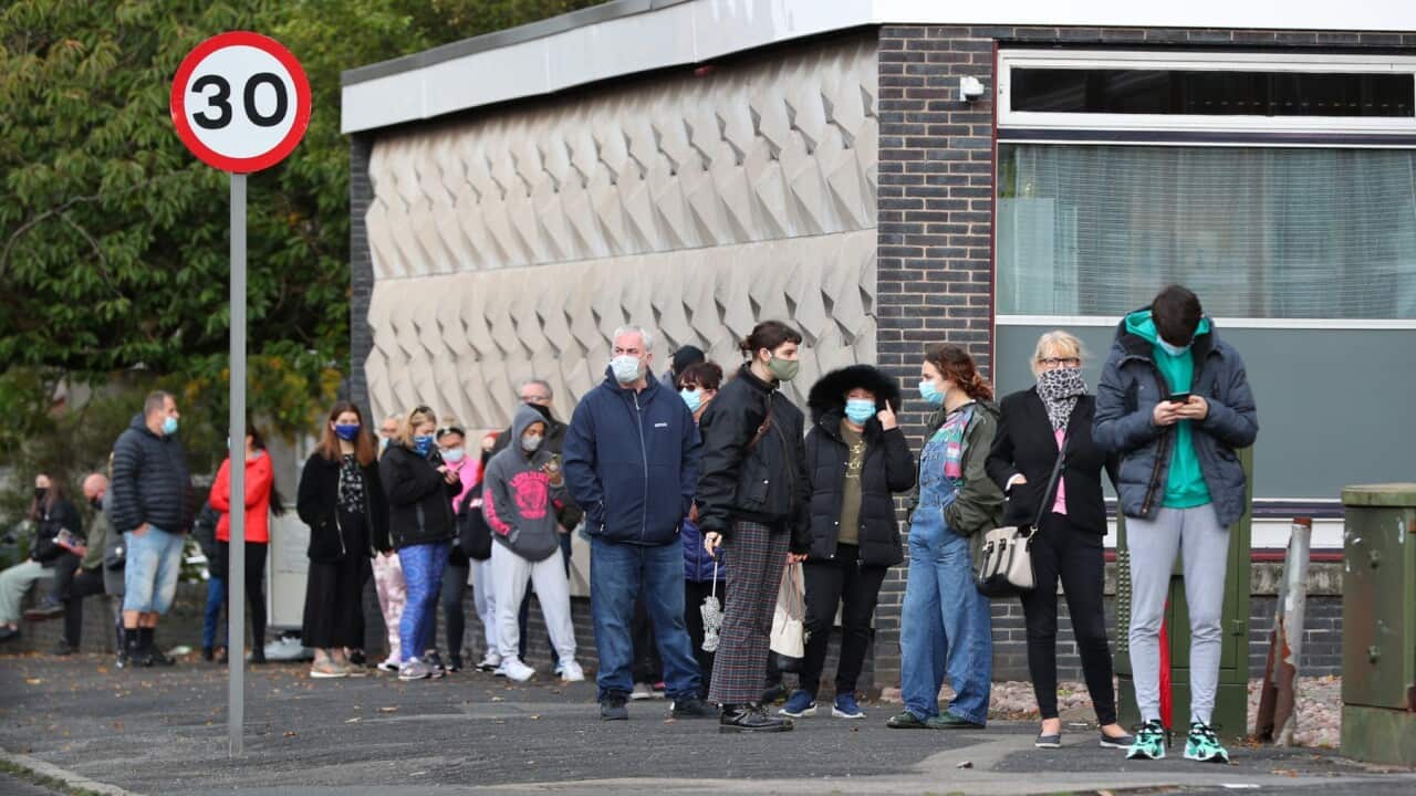 People queuing outside a walk-in coronavirus test centre at Allerton Library in Liverpool amid rising cases across parts of England, with the latest weekly infection figures showing Knowsley and Liverpool have the second and third highest rates, at 498.5