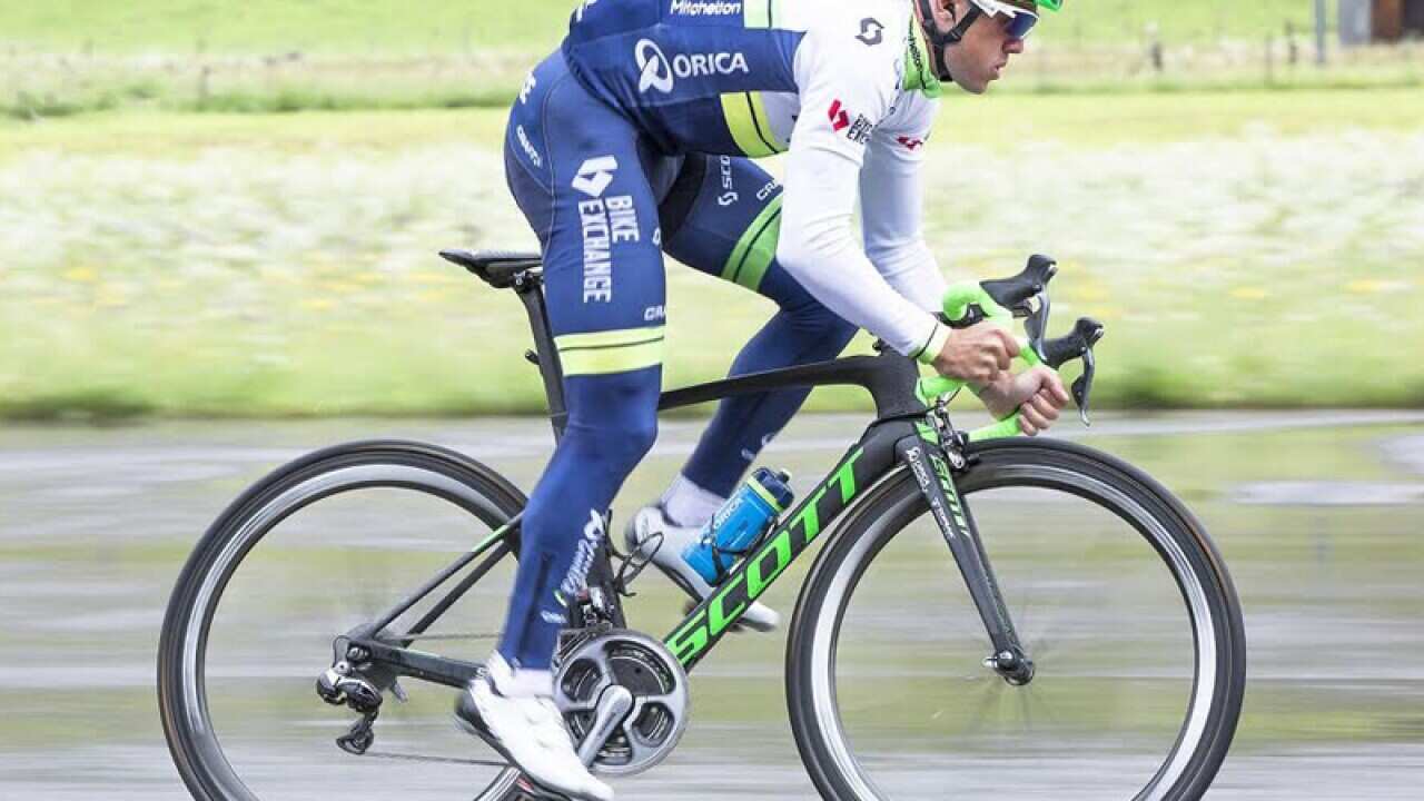 An Orica-GreenEDGE cyclist with a new Scott Sports helmet