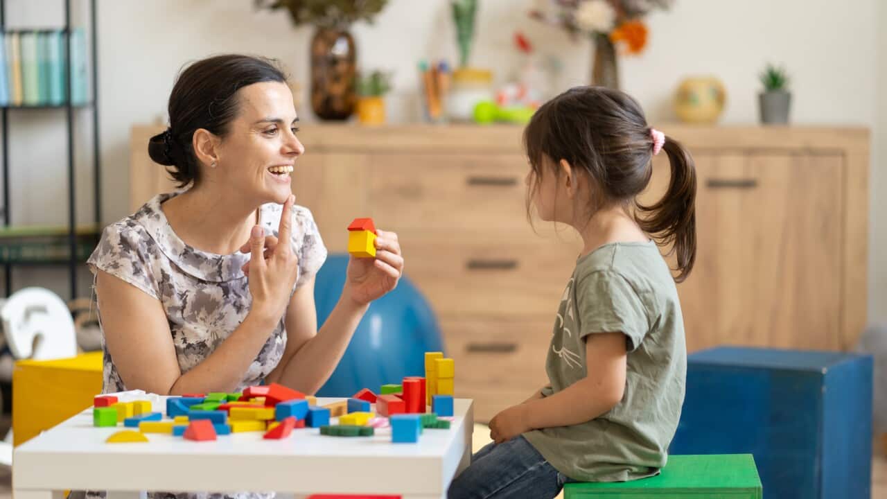 Therapist and child engaging with blocks