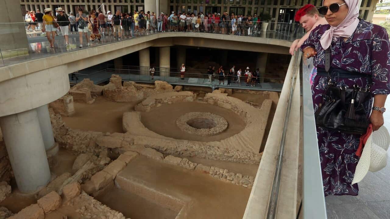 Visitors view the excavation site beneath the Museum of Acropolis in Athens, Greece, 21 June 2019, during the museum's 10 years celebration. 