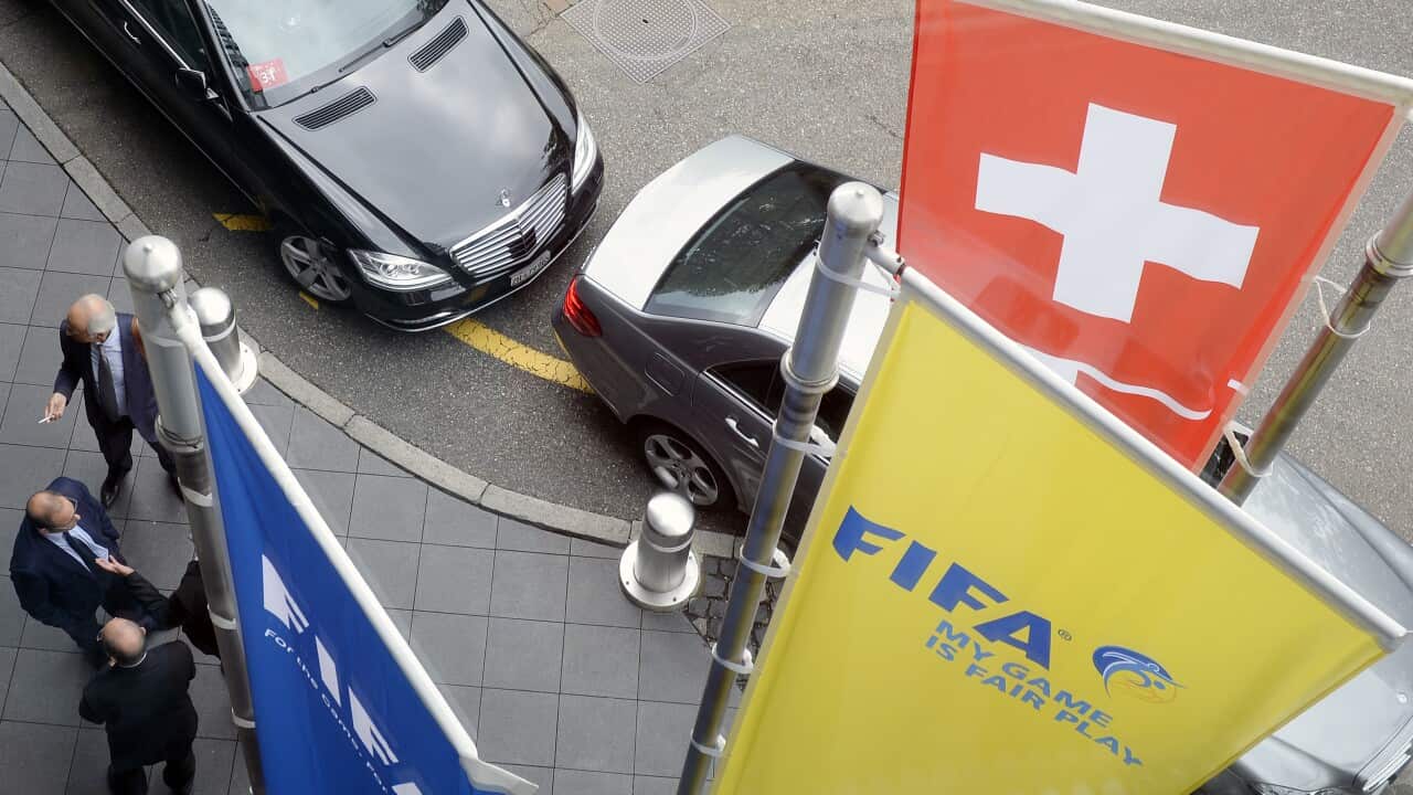 FIFA officials wait in front of the Marriott Hotel on the occasion of a meeting ahead of the FIFA congress, in Zurich, Switzerland, Wednesday, May 27, 2015. (KEYSTONE/Walter Bieri)
