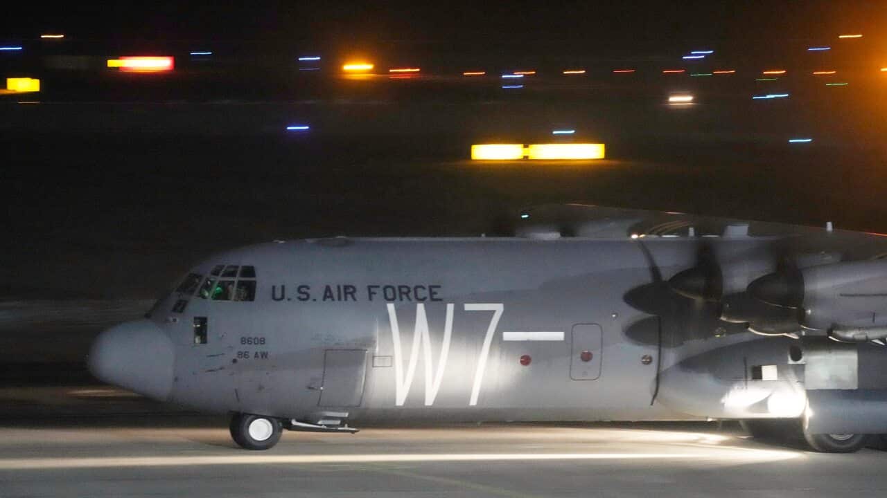 A U.S. Army transport plane with military equipment just after landing