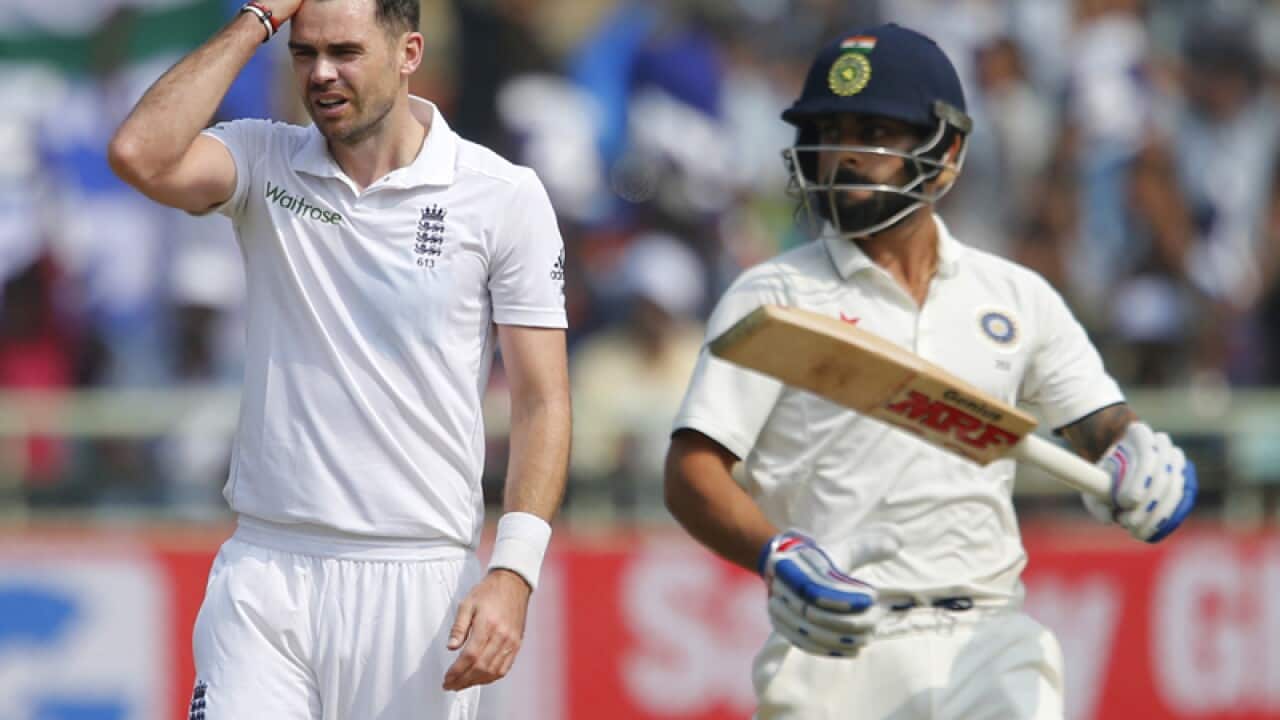 England's James Anderson (L)