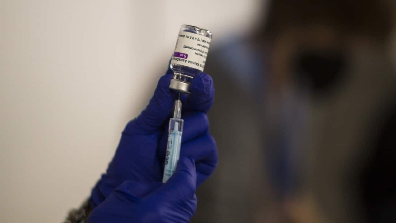 Vaccine being put into needle