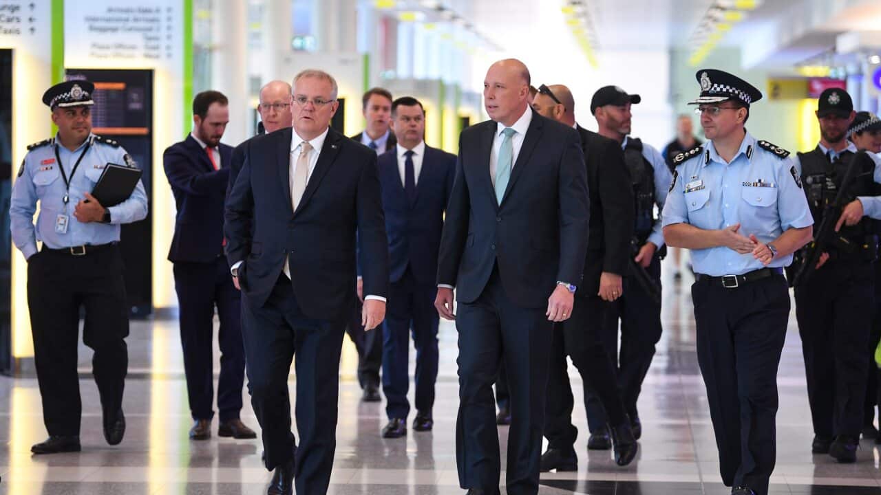 Scott Morrison and Peter Dutton are seen during an announcement to increase counter-terrorism measures at Canberra Airport in Canberra