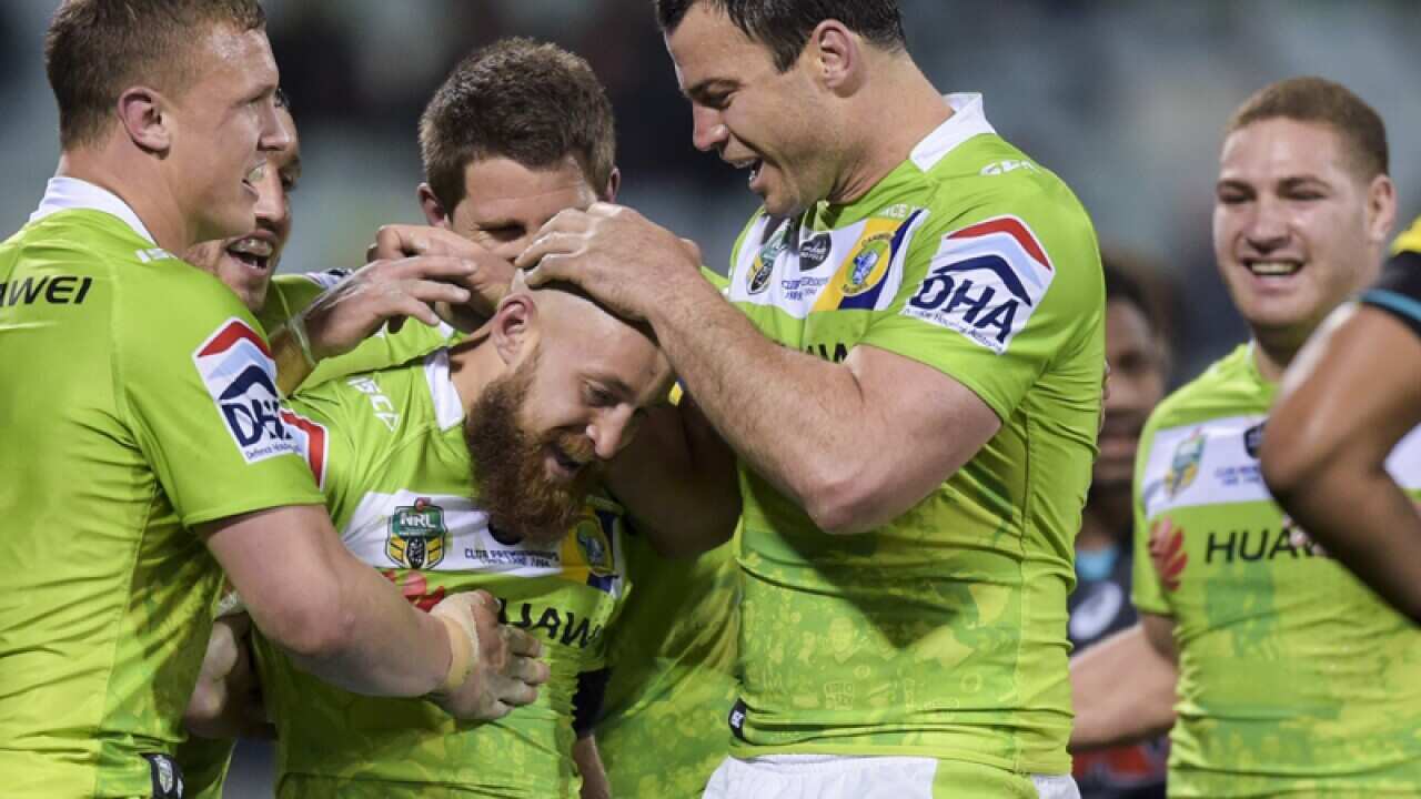 Kurt Baptiste of the Raiders (centre)