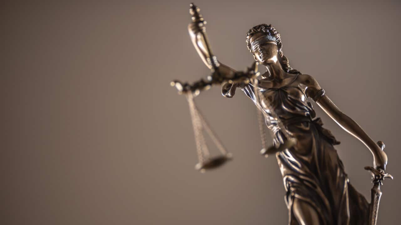 Statue of the lady of justice with scales close-up.