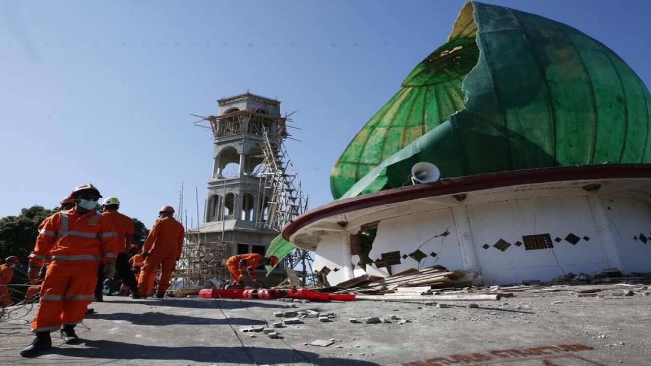 Rescuers look for suvivors