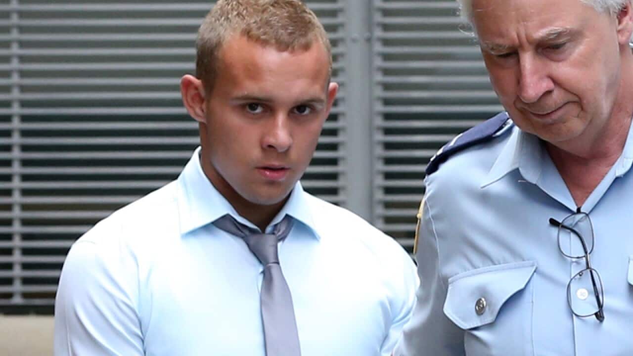 Kieran Loveridge being led from the St James Supreme Court