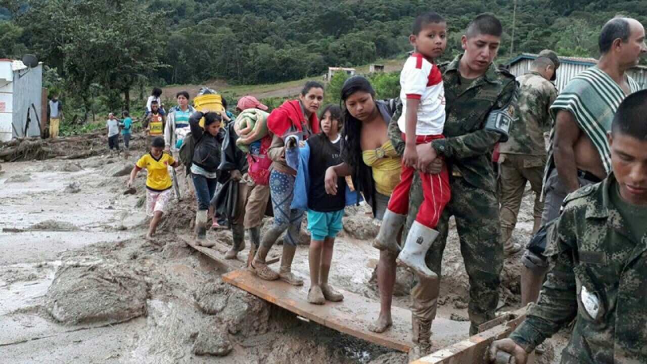 Soldiers working in the evacuation of victims from the landslide