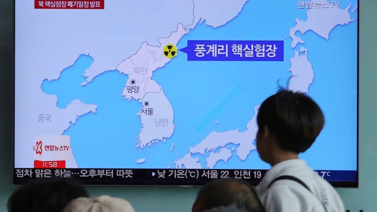 People watch a TV screen reporting that North Korea will dismantle nuke test site during a news program at the Seoul Railway Station in Seoul, South Korea, Sunday, May 13, 2018.