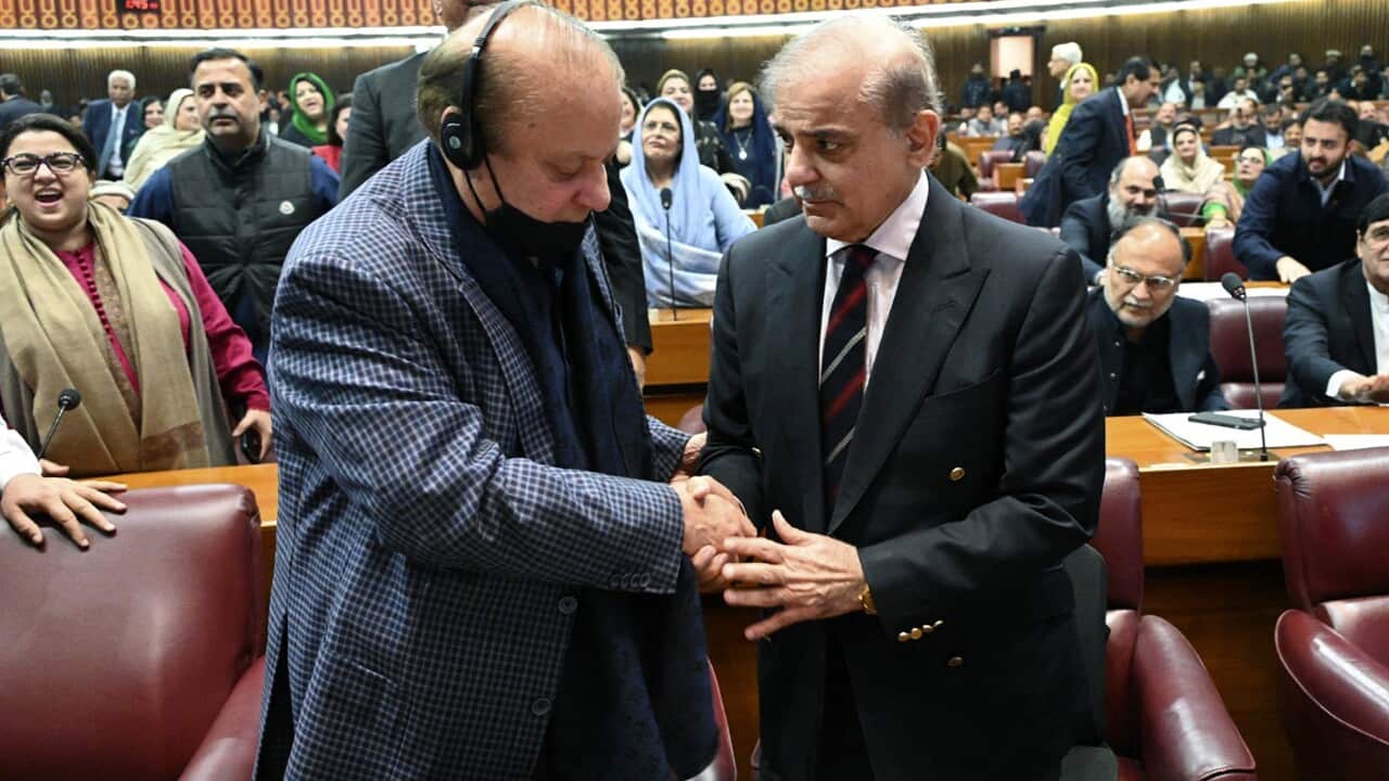 Pakistan's new PM Shehbaz Sharif is congratulated by his elder brother and former PM Nawaz Sharif (AAP)