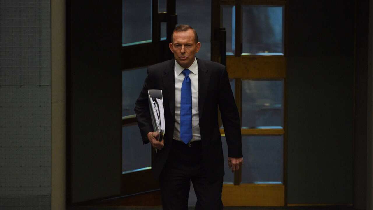 Australian Prime Minister Tony Abbott arrives for Question Time in the House of Representatives at Parliament House in Canberra, Tuesday, Aug. 18, 2015. (AAP Image/Mick Tsikas) NO ARCHIVING