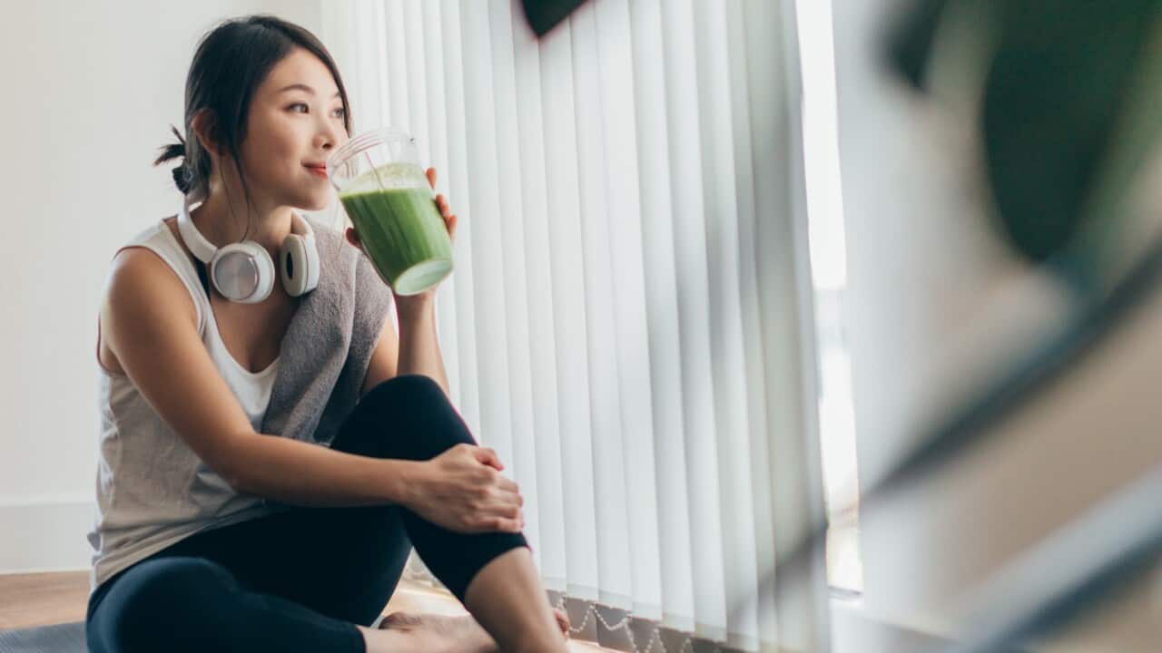 A woman drinking smoothie