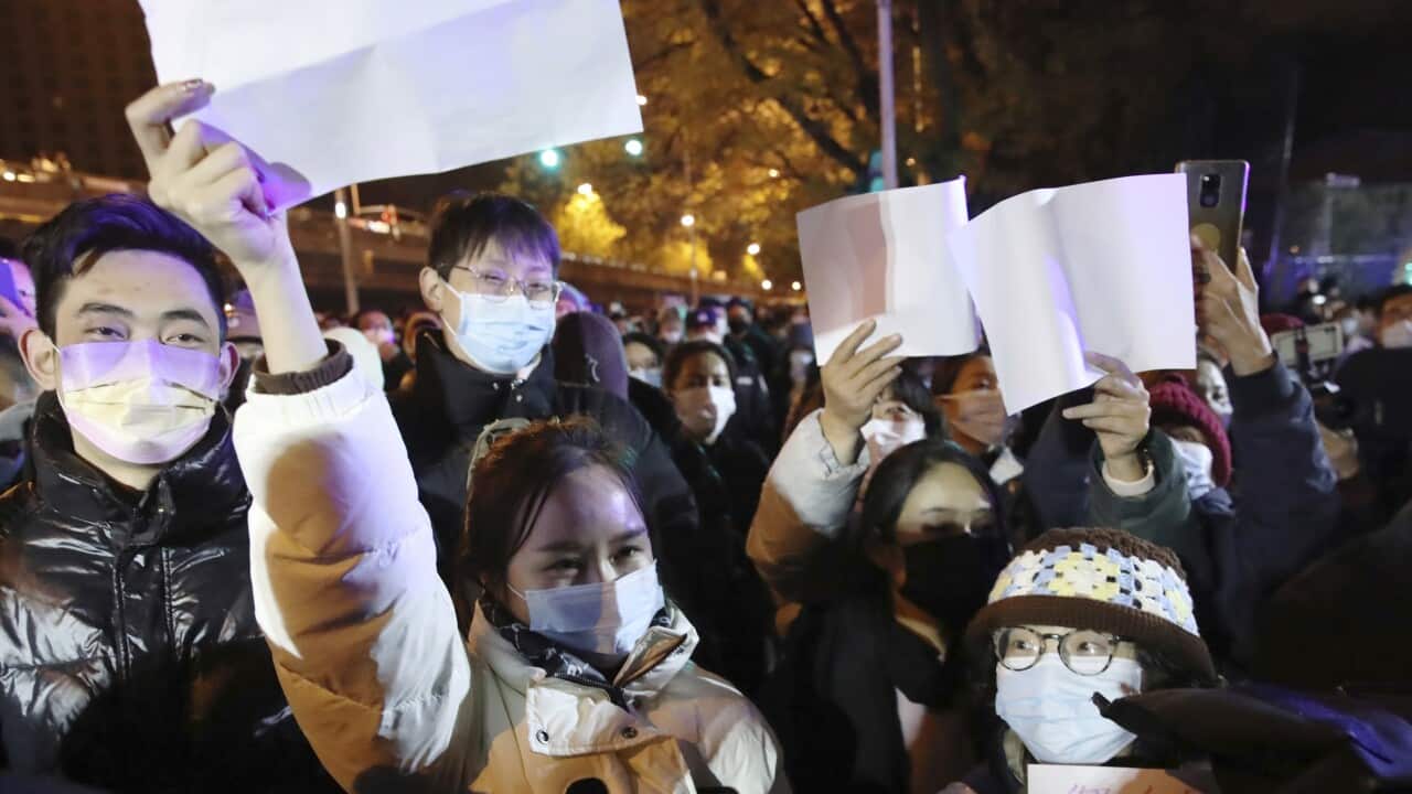 People held white paper to express their protest against Zero-Covid policy in Beijing on November 27, 2022.