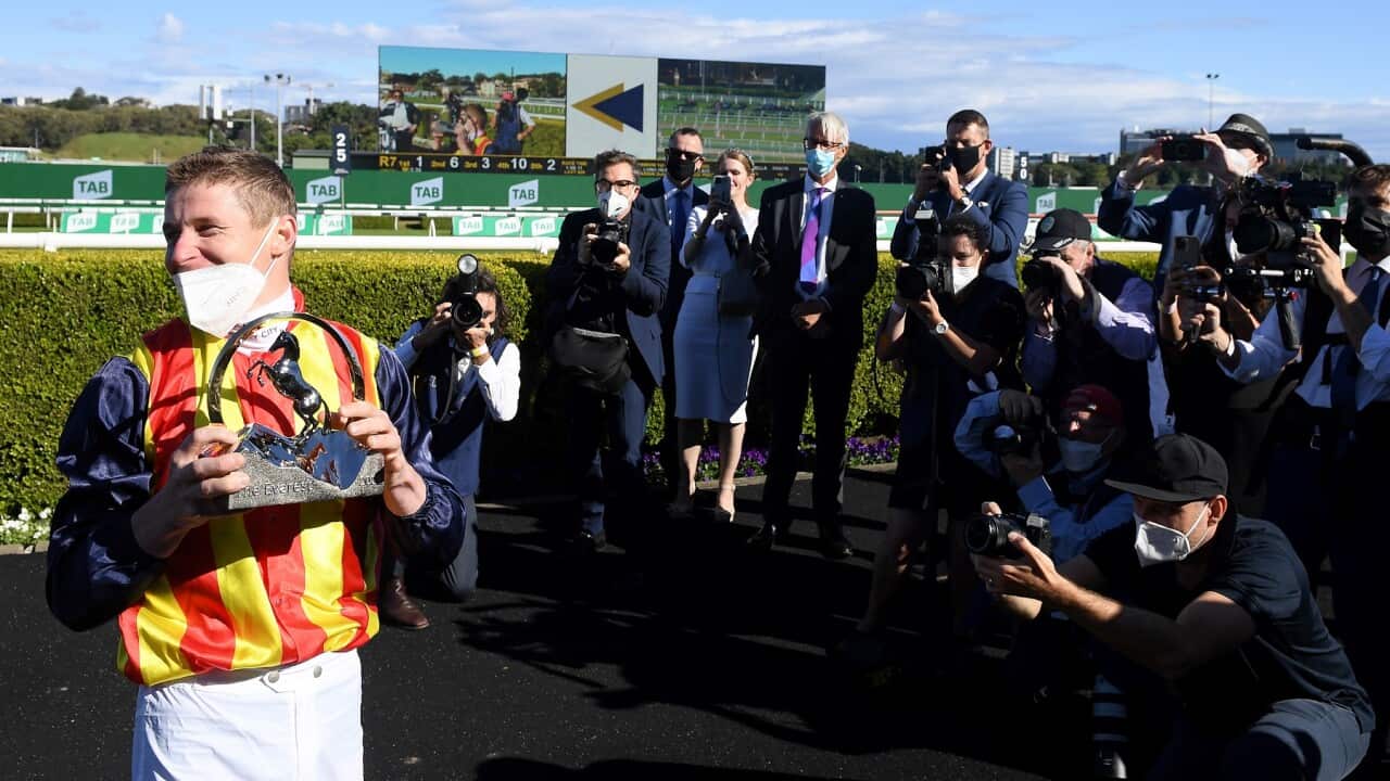 Jockey James McDonald lifts the Everest jockey’s trophy after riding Nature Strip to victory in race 7, The Everest, at Royal Randwick Racecourse in Sydney, Saturday, October 16, 2021. (AAP Image/Dan Himbrechts) NO ARCHIVING, EDITORIAL USE ONLY