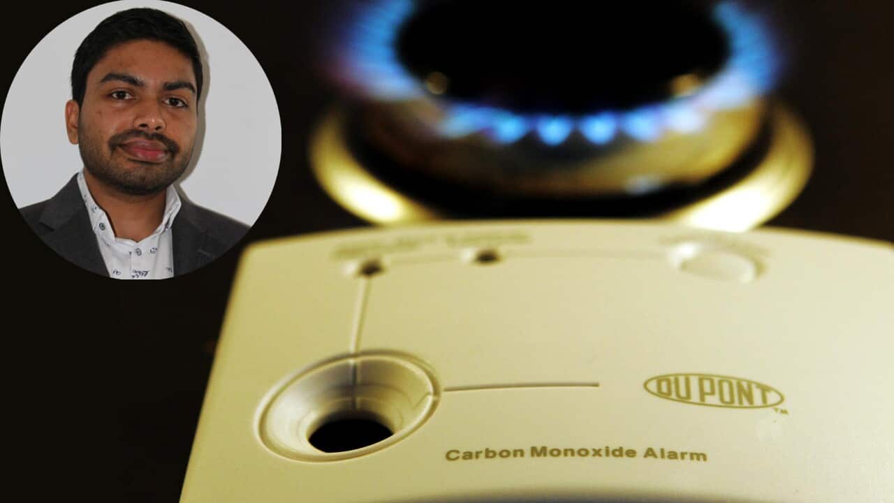 A carbon monoxide sensor unit beside a gas hob ring.