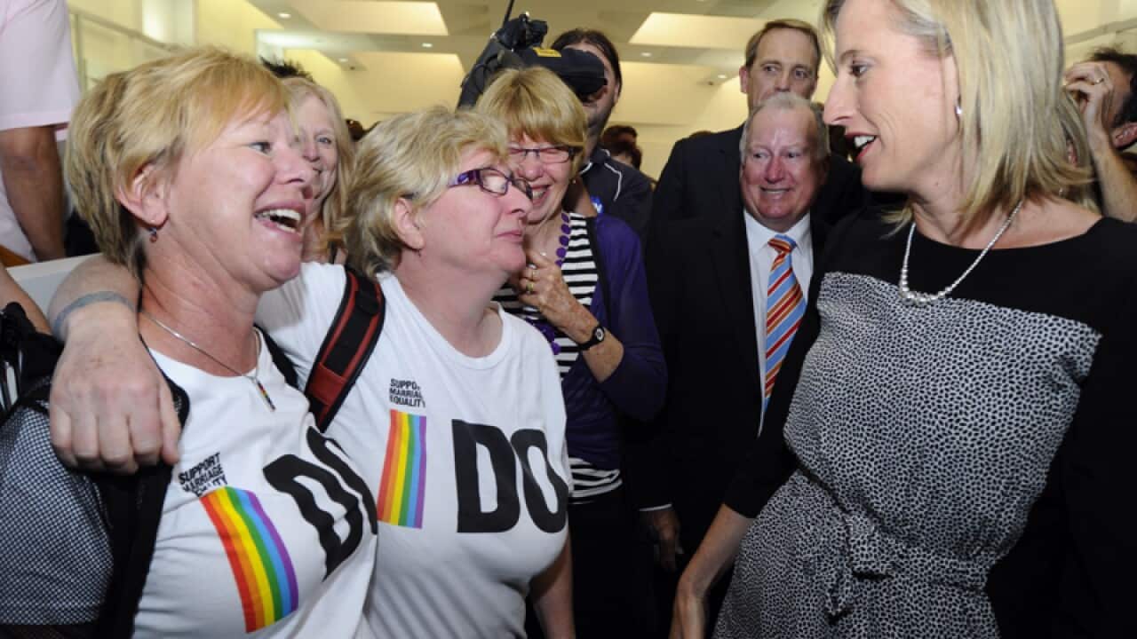 ACT Chief Minister Katy Gallagher (R) and marriage equality supporters