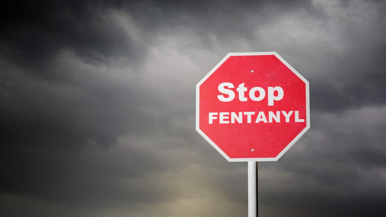 Stop Fentanyl Signboard with dark clouds
