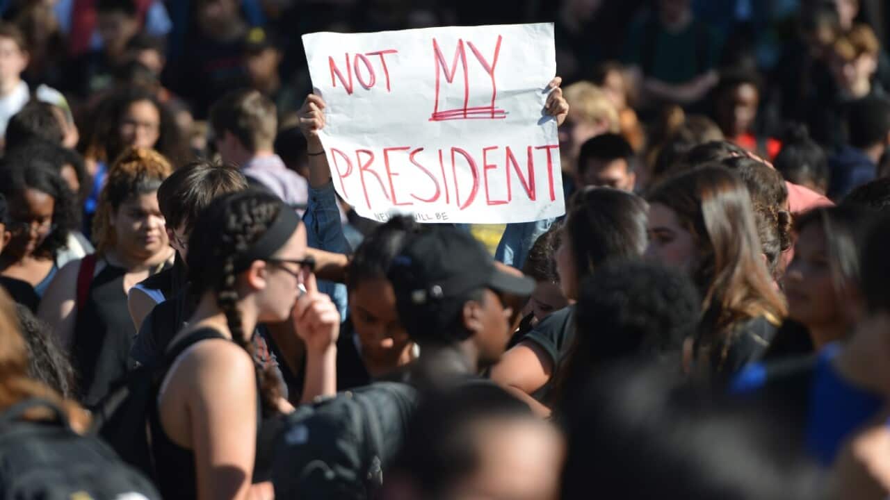 Protesters gather in front of Sather Tower at U.C. Berkeley in Berkley, California, in opposition of Donald Trump's presidential election win