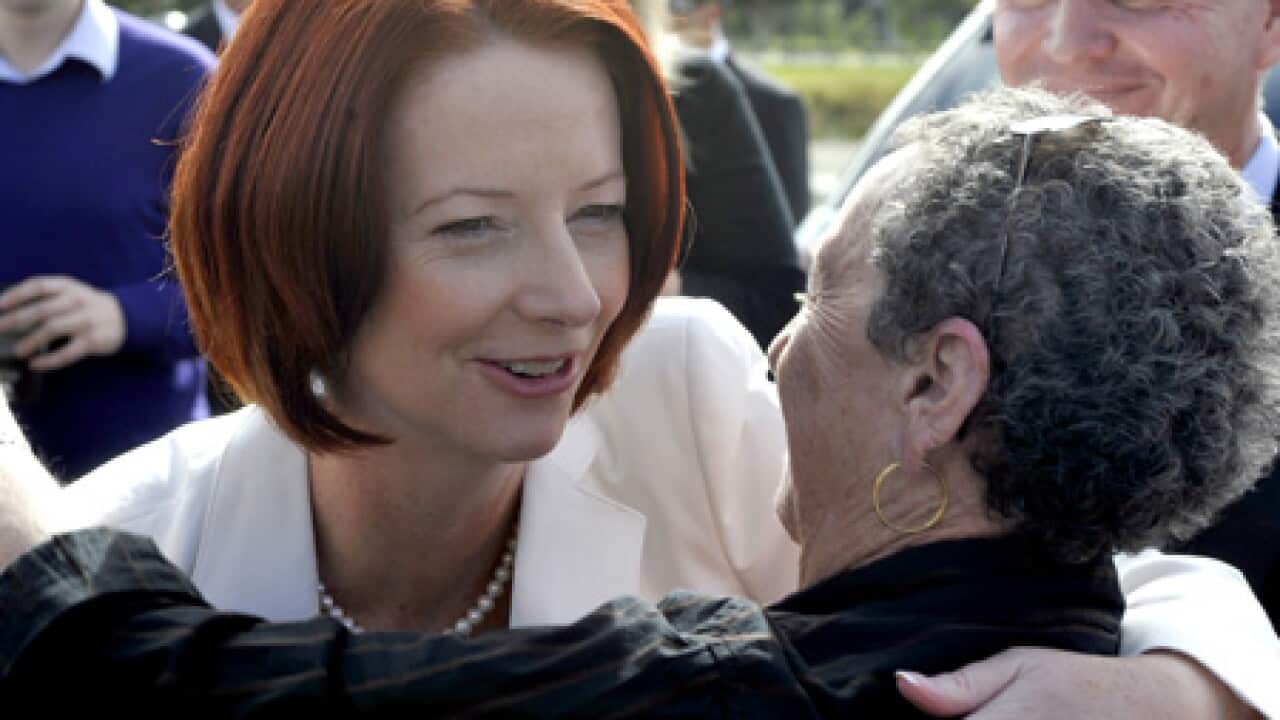 Gillard_hug_100724_B_AAP_598770944