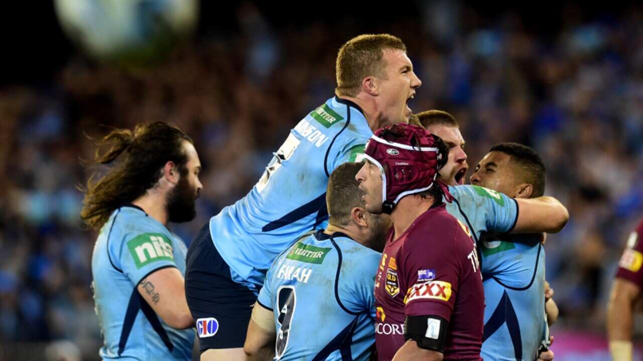 Josh Dugan of the Blues celebrates their win against the Maroons