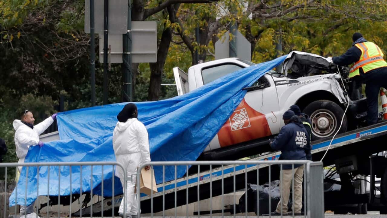 The truck used in the bike path attack is removed from the crime scene.