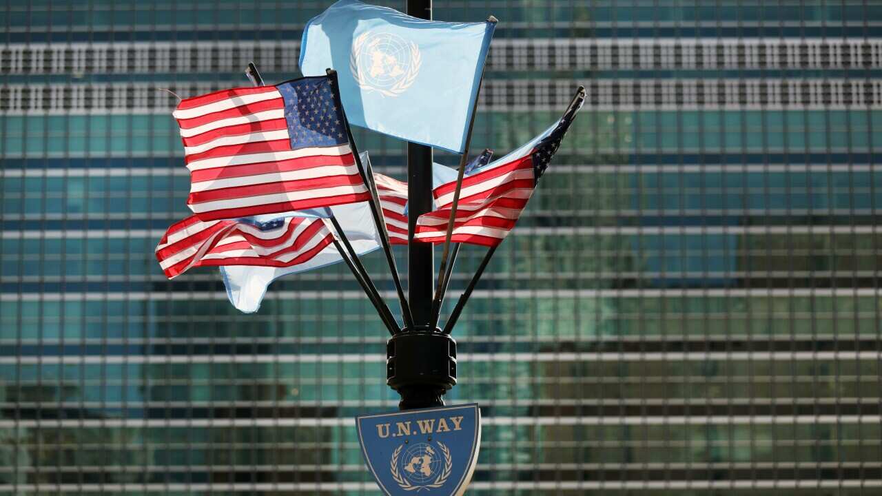United States of America and United Nations flags fly outisde the 75th United Nations General Assembly in Manhattan.