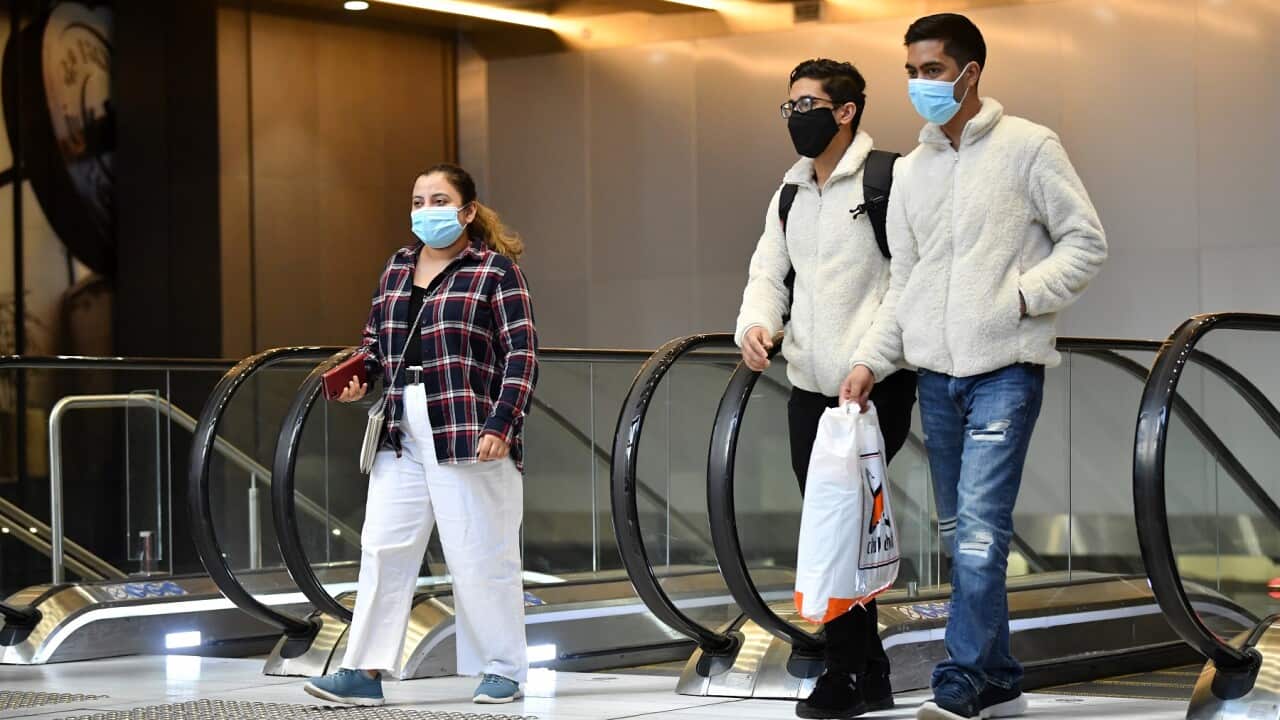 Commuters wearing face masks leave Wynyard Station in Sydney