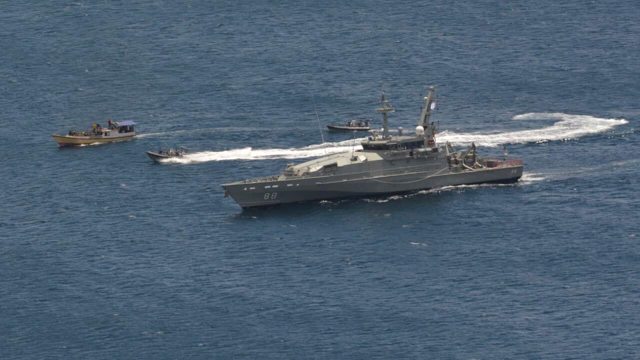 The Australian Navy escorts an asylum seeker boat to Christmas Island - Getty Images-1.jpg