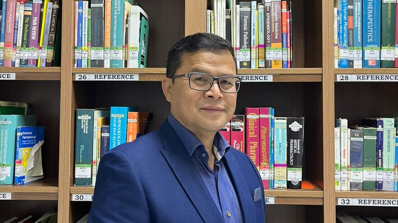 Dr Dicky Budiman PhD, Epidemiologist and an expert in Global Health Security at Griffith University and Yarsi University, in the library - June 2025.  Photo: Private collection.   