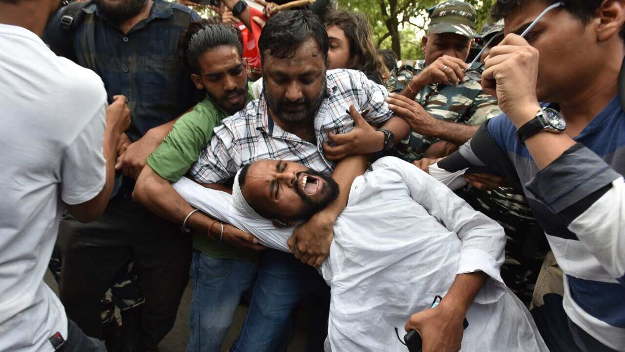 A person being arrested during a demonstration