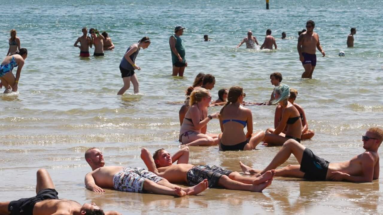 Bathers try to cool off in the hot weather