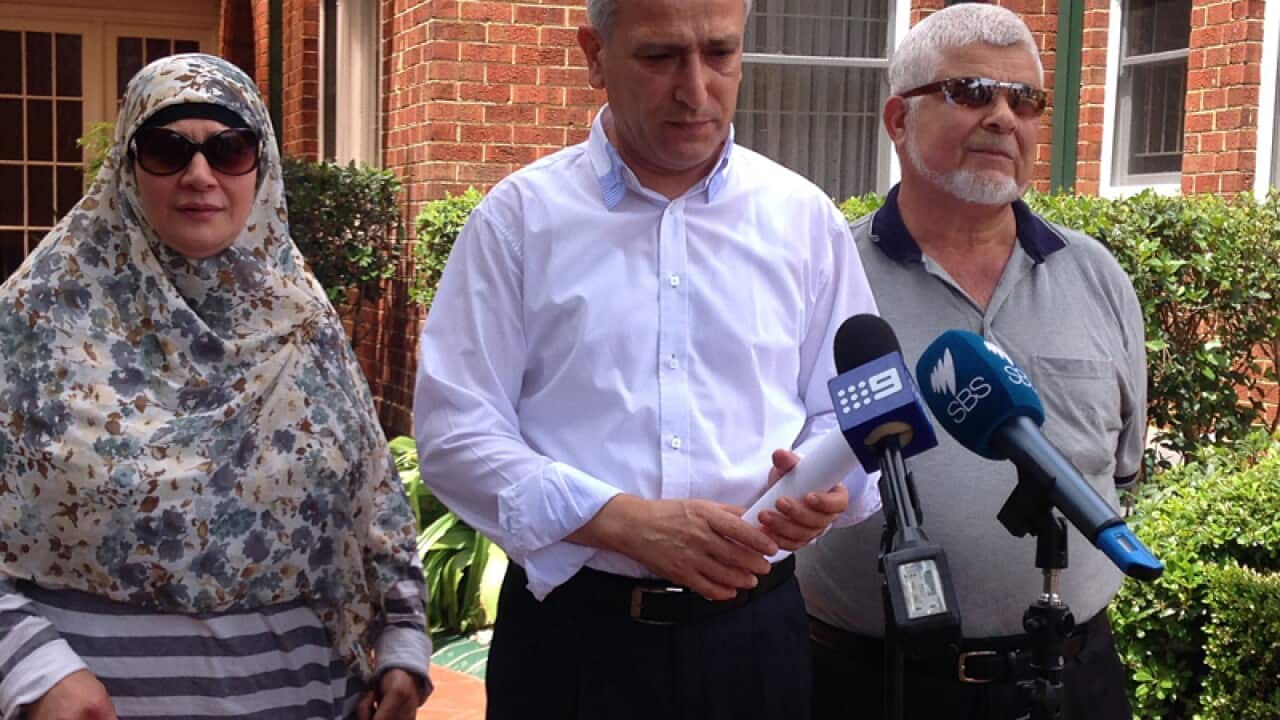 Muslim community leader Dr Jamal Rifi (c)