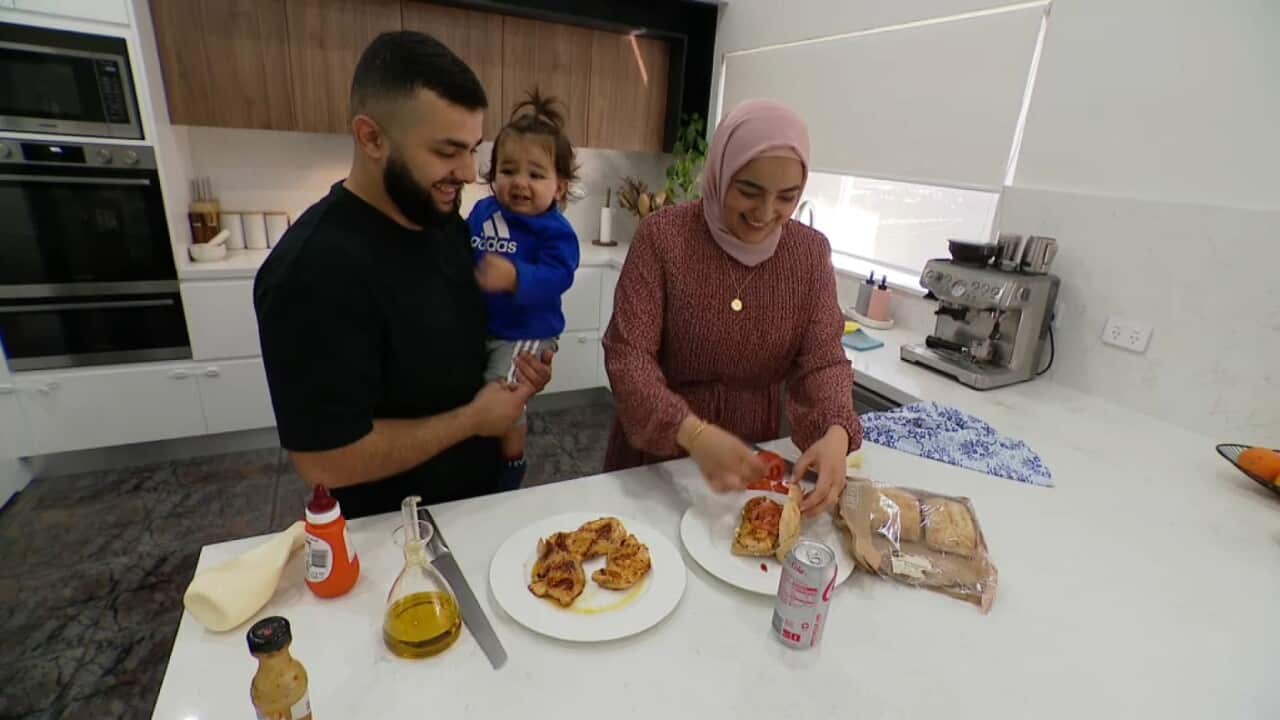 Jamil Awwad, Juman Abdoh and their son preparing a Halal meal in Sydney - May 12, 2023 SBS News .jpg