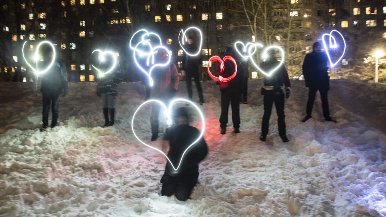 People draw hearts with their cellphones flashlights in support of jailed opposition leader Alexei Navalny and his wife Yulia Navalnaya