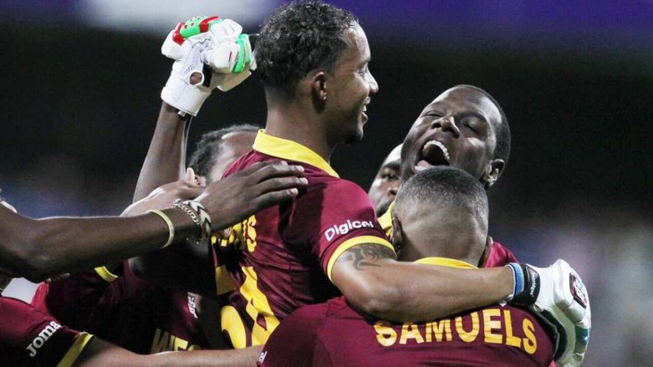 West Indies Lendl Simmons is held aloft by teammates as they celebrate their seven wicket win over India at the ICC World Twenty20 2016 cricket semifinal match at Wankhede stadium in Mumbai, India,Thursday, March 31, 2016.(AP Photo/Rafiq Maqbool)